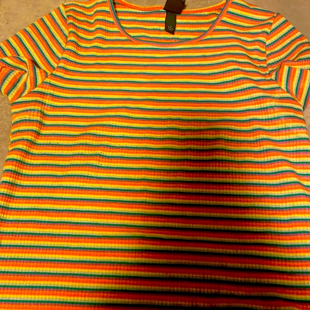 A rainbow cropped top with ruffles